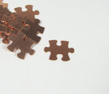 Copper Puzzle Blank,  puzzle piece, 22 gauge copper,  20mm x 16mm, 15 pack, autism stamp symbol,  for stamping, puzzle shape, for stamping, - Romazone