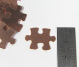 Copper Puzzle Blank,  puzzle piece, 22 gauge copper,  20mm x 16mm, 15 pack, autism stamp symbol,  for stamping, puzzle shape, for stamping, - Romazone