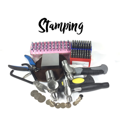 Metal stamping tools, steel graphic stamps, steel blocks, various hammers and letter sets.