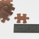 Copper Puzzle Blank,  puzzle piece, 22 gauge copper,  20mm x 16mm, 15 pack, autism stamp symbol,  for stamping, puzzle shape, for stamping, - Romazone